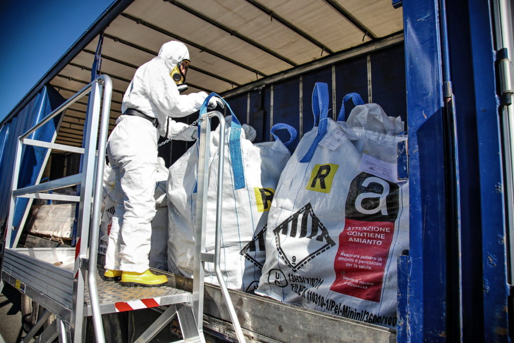 Person removing asbestos